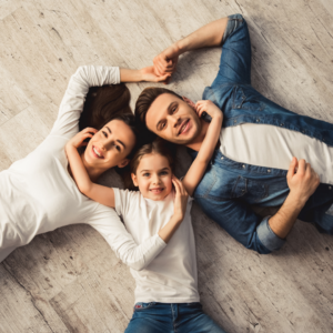 A family lying on the floor 