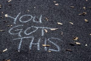 "You got this" written in chalk on the ground